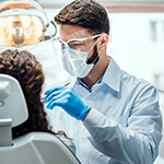 Dentist conducting dental exam